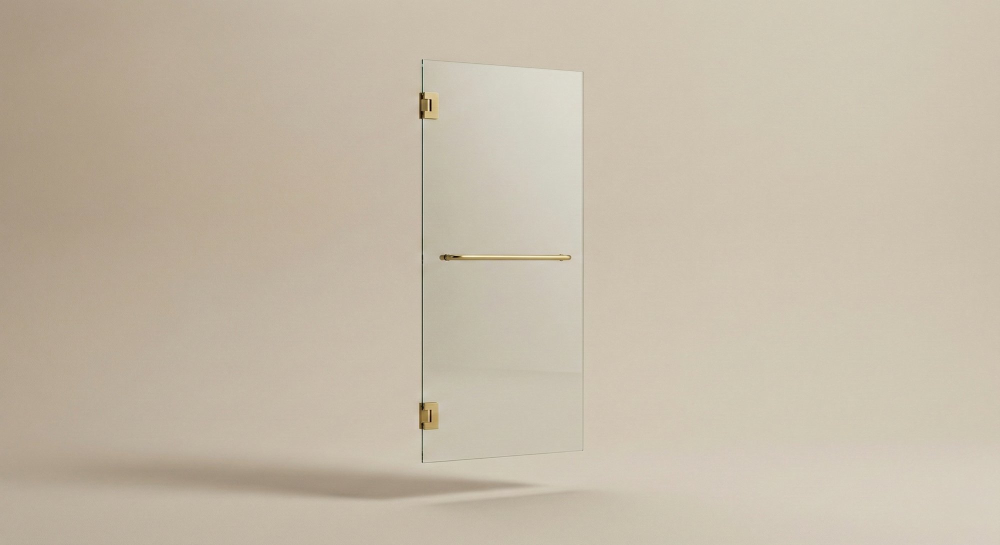 Single swing frameless shower door with satin brass hinges and towel bar handle