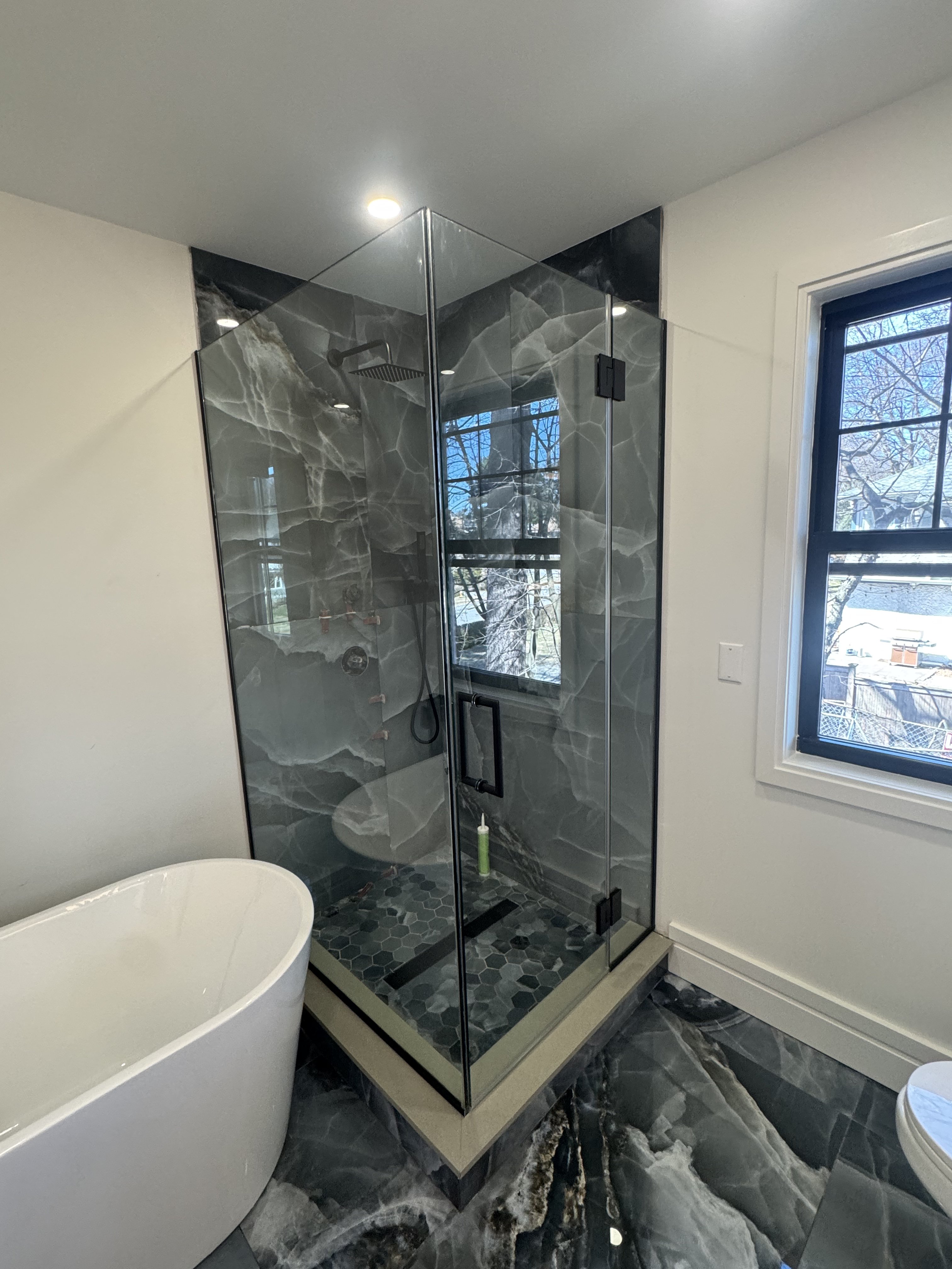 Frameless shower door and bathroom glass planning for a Brooklyn shower