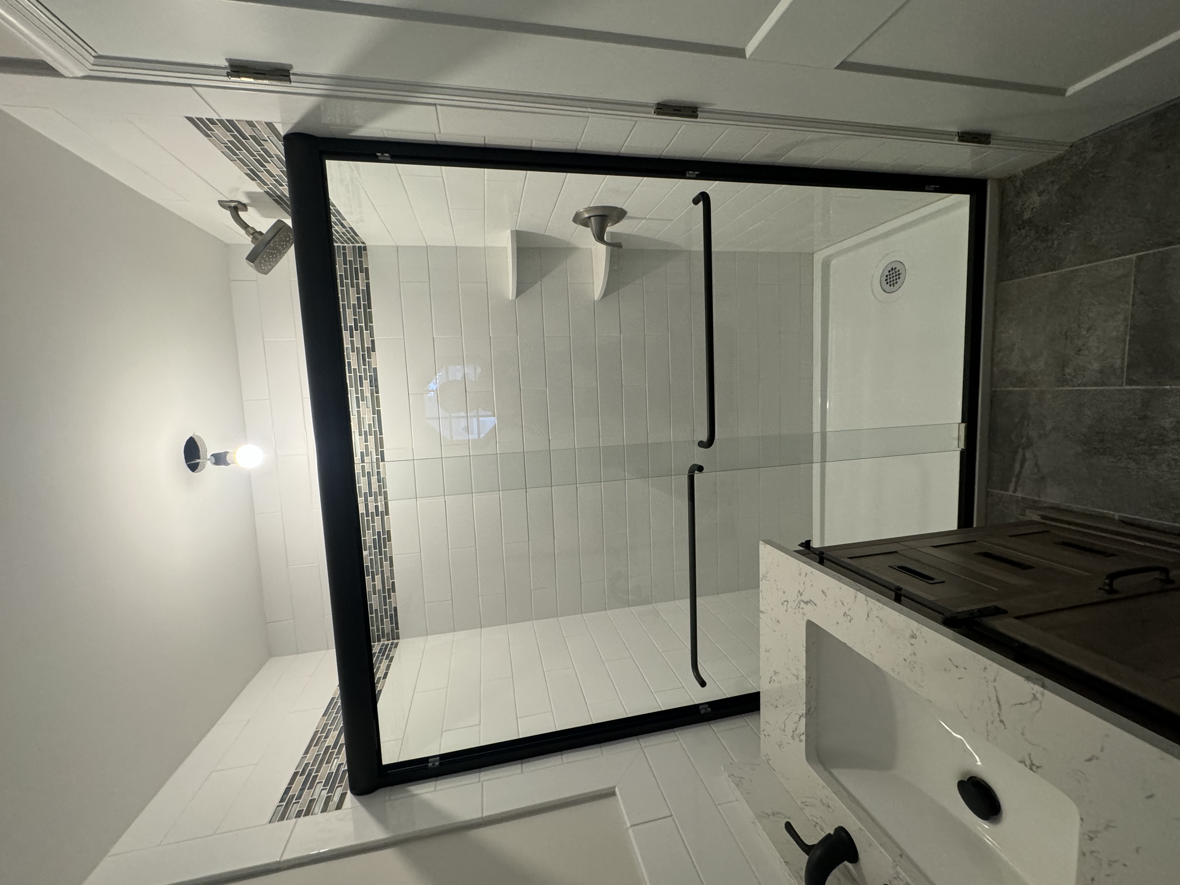 Frameless shower door and bathroom glass planning for an Upper East Side shower