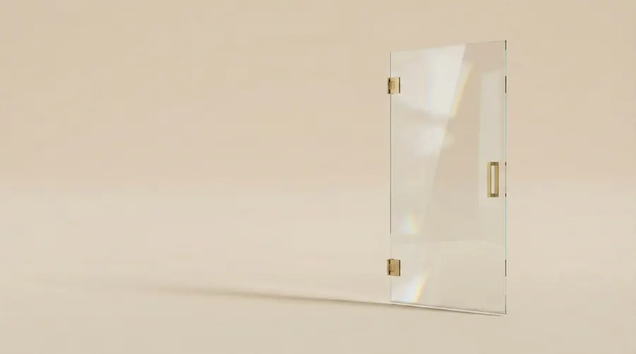 Frameless shower door with gold hinges