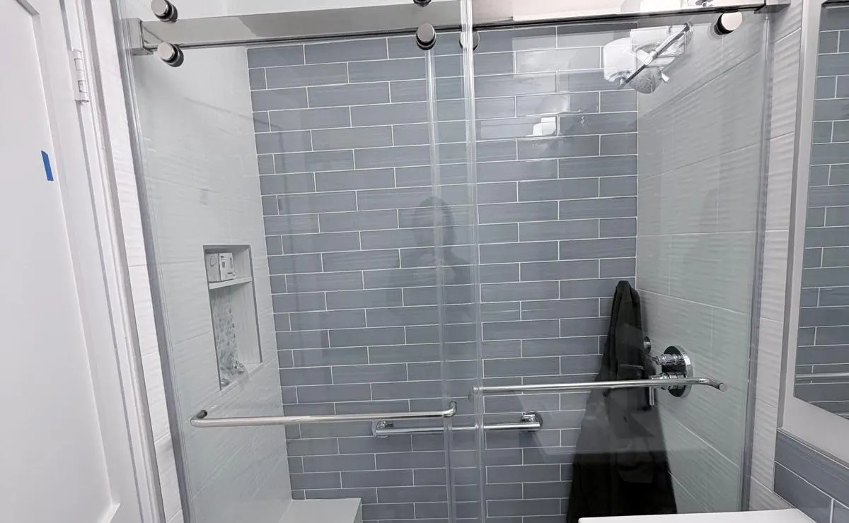 Completed sliding shower door at 84 Clinton in the Lower East Side, Manhattan