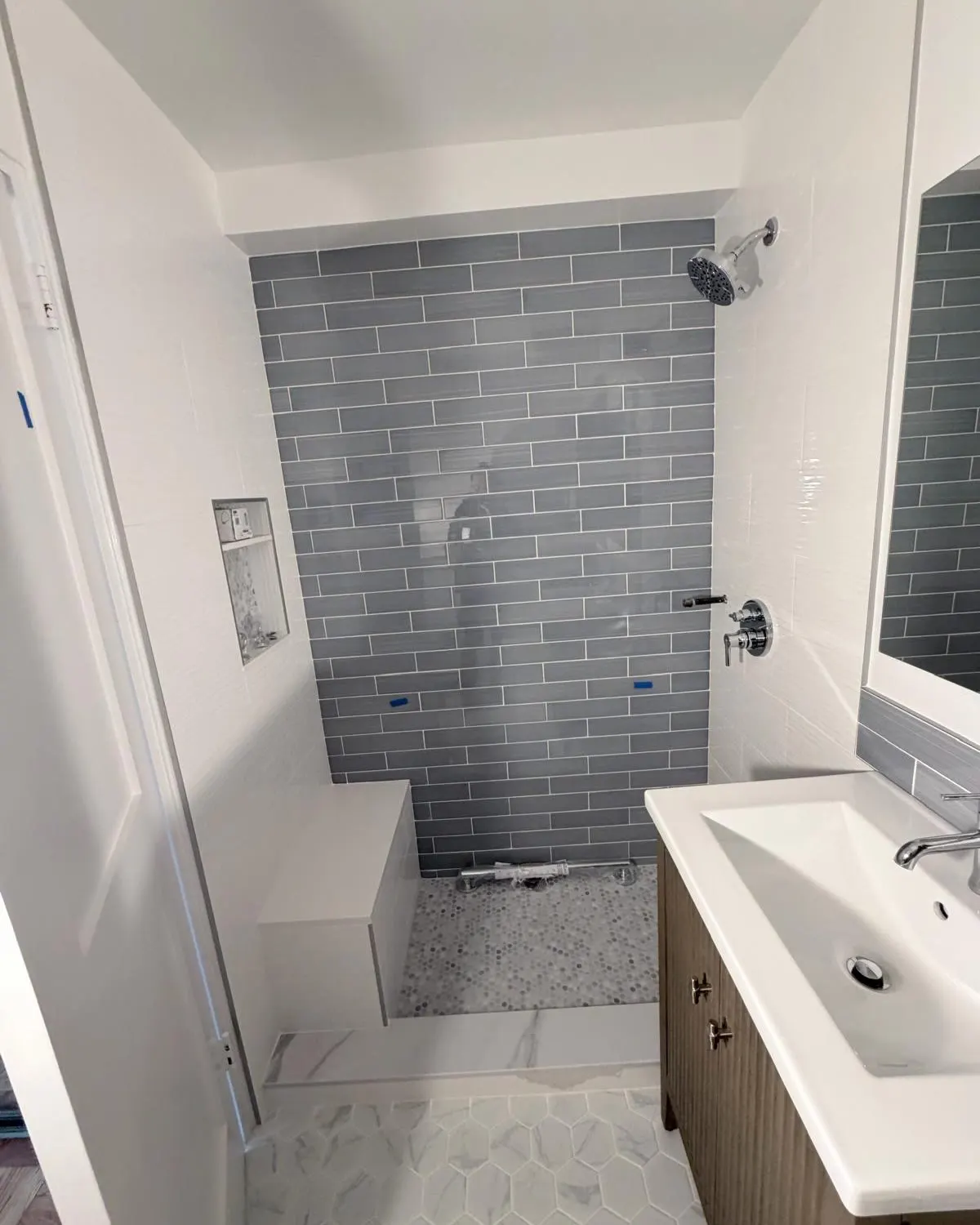 Before shower area at 84 Clinton, Lower East Side Manhattan, before sliding glass shower door installation.