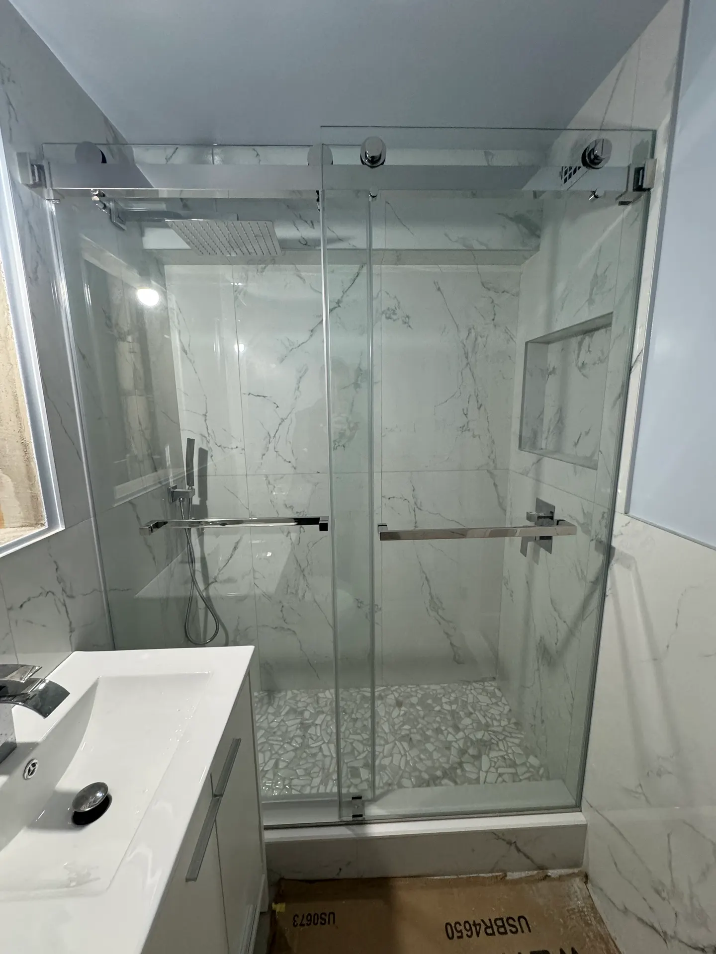 Bathroom mirror with J-channel mounting